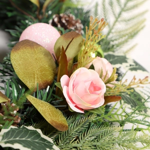 Artificial Christmas wreath featuring pink roses, gold ornaments and pine cones