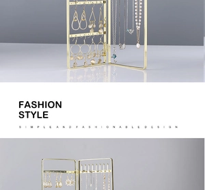Detail of a foldable golden metal earring stand with a stylish screen-like structure