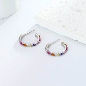 Detailed view of 925 sterling silver C-shaped earrings with colorful zircon stones