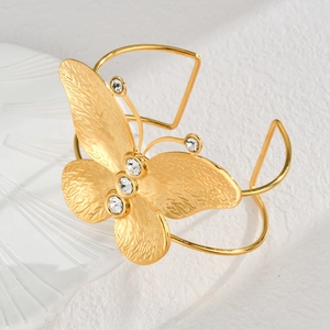 Elegant gold butterfly open bangle in stainless steel with sparkling crystal accents