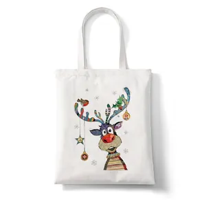 White Christmas canvas tote bag with colorful reindeer illustration and star details