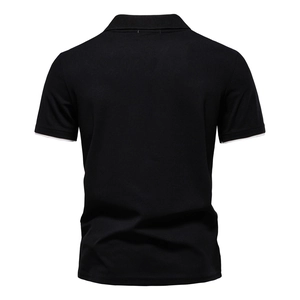 Back view of black polo shirt featuring contrasting white trim on the sleeves detail