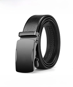 Detail of lychee pattern leather belt for men with a metallic black automatic buckle