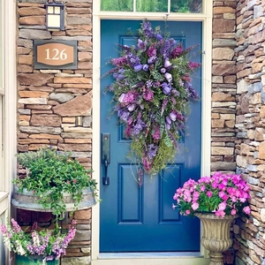 Spring purple tulip teardrop wreath with mixed flowers on a blue front door decor