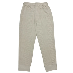 Detail shot of men's casual joggers showing breathable diamond jacquard knit fabric texture