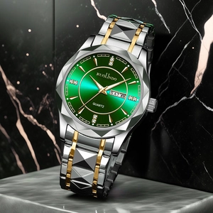 Macro detail of men's watch featuring a green sunburst dial and faceted cutting bezel