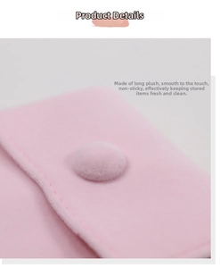 Detail view of pink plush jewelry bag with soft faux fur texture and matching snap button