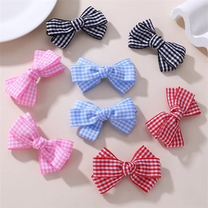 Detailed set of multi-color gingham checkered bow hair clips in black, pink, blue and red