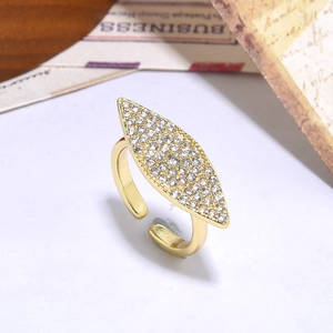 Gold plated hip hop eye ring with sparkling marquise diamond shape on white background