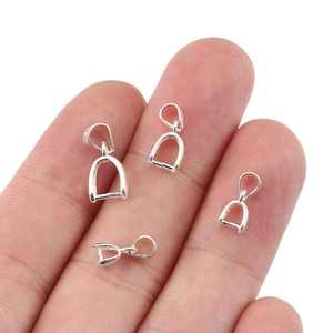 S925 sterling silver pinch bails for pendants in four sizes held on fingertips