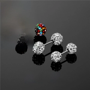 Barbell piercing jewelry set in stainless steel with crystal rhinestones on black background