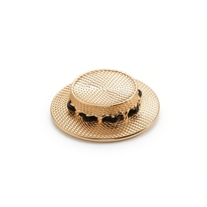 Golden metal boater hat brooch with woven texture and black leather chain detail