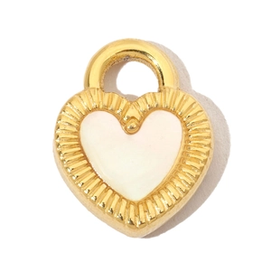 Macro shot of heart-shaped pendant with golden edges and white shell-style center finish