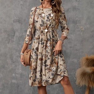 Detail of floral print midi dress with three-quarter sleeves and bohemian patterns