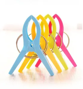 Detail of colorful plastic laundry pegs with high-elasticity metal spring for windproof use