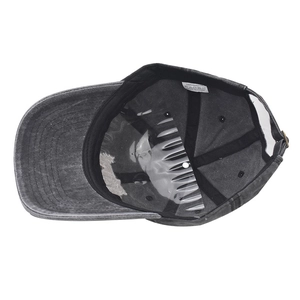 Detail of washed grey baseball cap showing sweatband, plastic support, and adjustable buckle