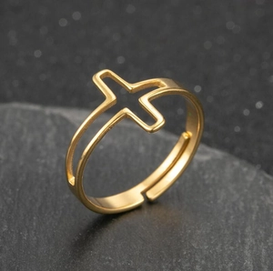 Minimalist gold hollow cross ring with open adjustable band on dark stone base