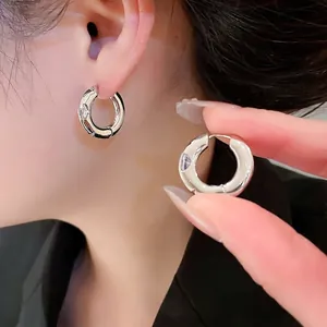Polished silver hoop earrings for women with minimalist round design and secure clasp