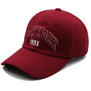 Detailed embroidery of 199X NEW YORK on a burgundy cotton canvas baseball cap