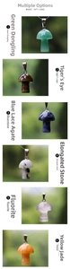 Macro detail of mushroom stone pendants in Tiger's eye and diverse gemstones