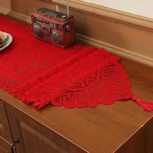 Red Christmas lace table runner with hollow floral patterns and fringe tassels decoration