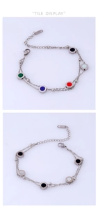 Detail of colorful double-layer stainless steel bracelet with enamel round charms