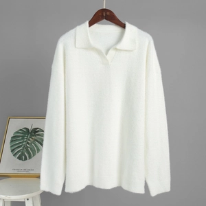 Detailed texture of white mink-fleece knit polo sweater with fluffy soft fibers