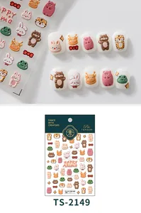 Detailed macro view of 3D embossed cartoon animal nail stickers with cute bear and rabbit motifs