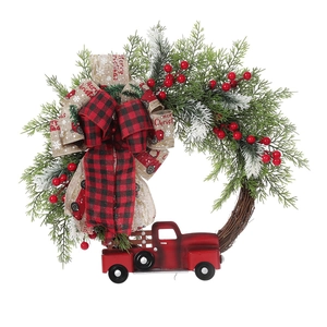 Christmas wreath with a vintage red truck, pine needles, berries, and Merry Christmas bows