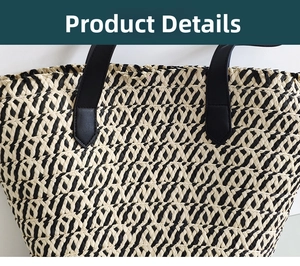 Detail of woven straw tote bag featuring contrast textures and leather handle stitching