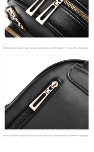 Detail of smooth gold hardware zippers on black lychee texture leather backpack