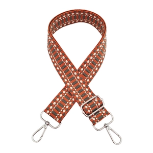 Detail of woven bag strap in orange, grey and white with silver metal hooks