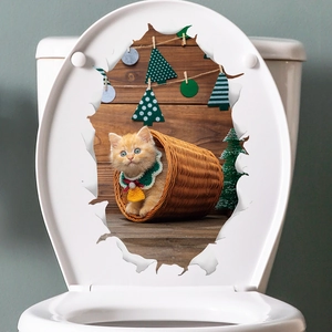 3D Christmas cat wall sticker showing an orange kitten in a basket on a toilet lid