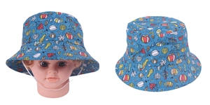 Detail view of baby sun hat featuring blue pumpkin print and adjustable white chin strap