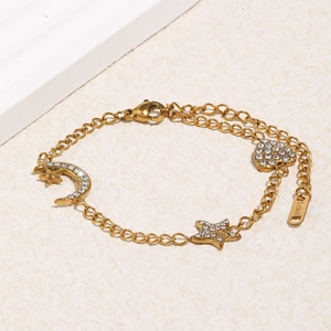 Bracelet doré en acier inoxydable avec breloques lune étoile et cœur ornées de cristaux