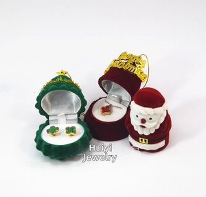 Detail of Christmas themed velvet jewelry boxes with clover earrings and necklace