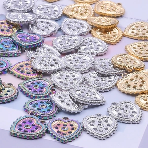 Minimalist heart-shaped hollow pendants in gold, silver, and rainbow steel colors