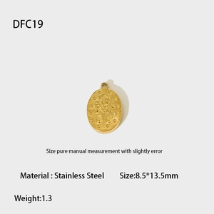 Macro detail of a 13.5mm oval gold-plated stainless steel religious pendant with embossing