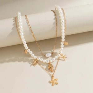Three-layer beach style necklace with faux pearls, gold starfish and seashell pendants