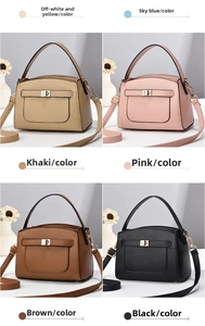 Close-up of lychee grain leather crossbody bag with metallic twist lock and handle