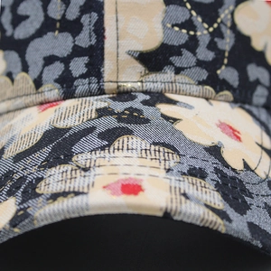 Close-up of floral leopard print on cotton fabric with reinforced stitching detail