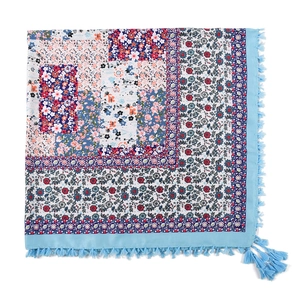 Detail of blue Bohemian cotton scarf with ethnic jacquard patterns and knotted tassels
