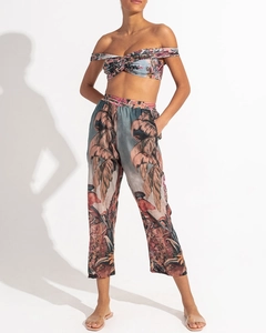 Detail shot of tropical print one-shoulder crop top and matching high-waist trousers