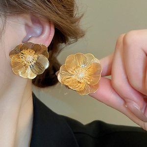 Vintage gold plated floral stud earrings with brushed metallic texture for women