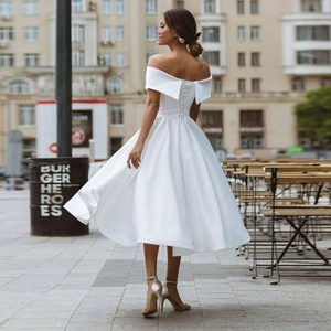 Elegant off-shoulder satin wedding dress with a lace-up back and A-line midi skirt