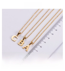 Detail showing height measurements of 18k gold plated alphabet pendant necklaces