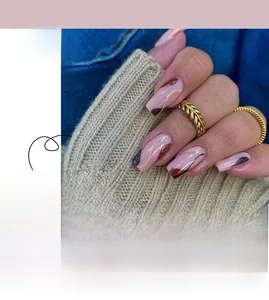 Detail of medium-long press on nails with brown wave lines and French style art