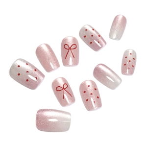 Pink pearl gradient press-on nails with red polka dots and bowknot design