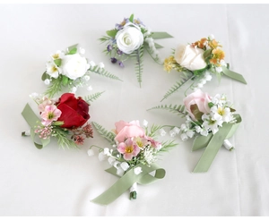 Detailed set of 6 varied artificial rose boutonnieres with silk ribbons and greenery