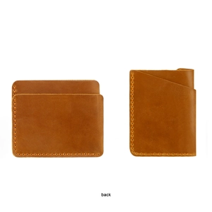 Macro view of vintage brown leather card holder with detailed hand-stitched sewing